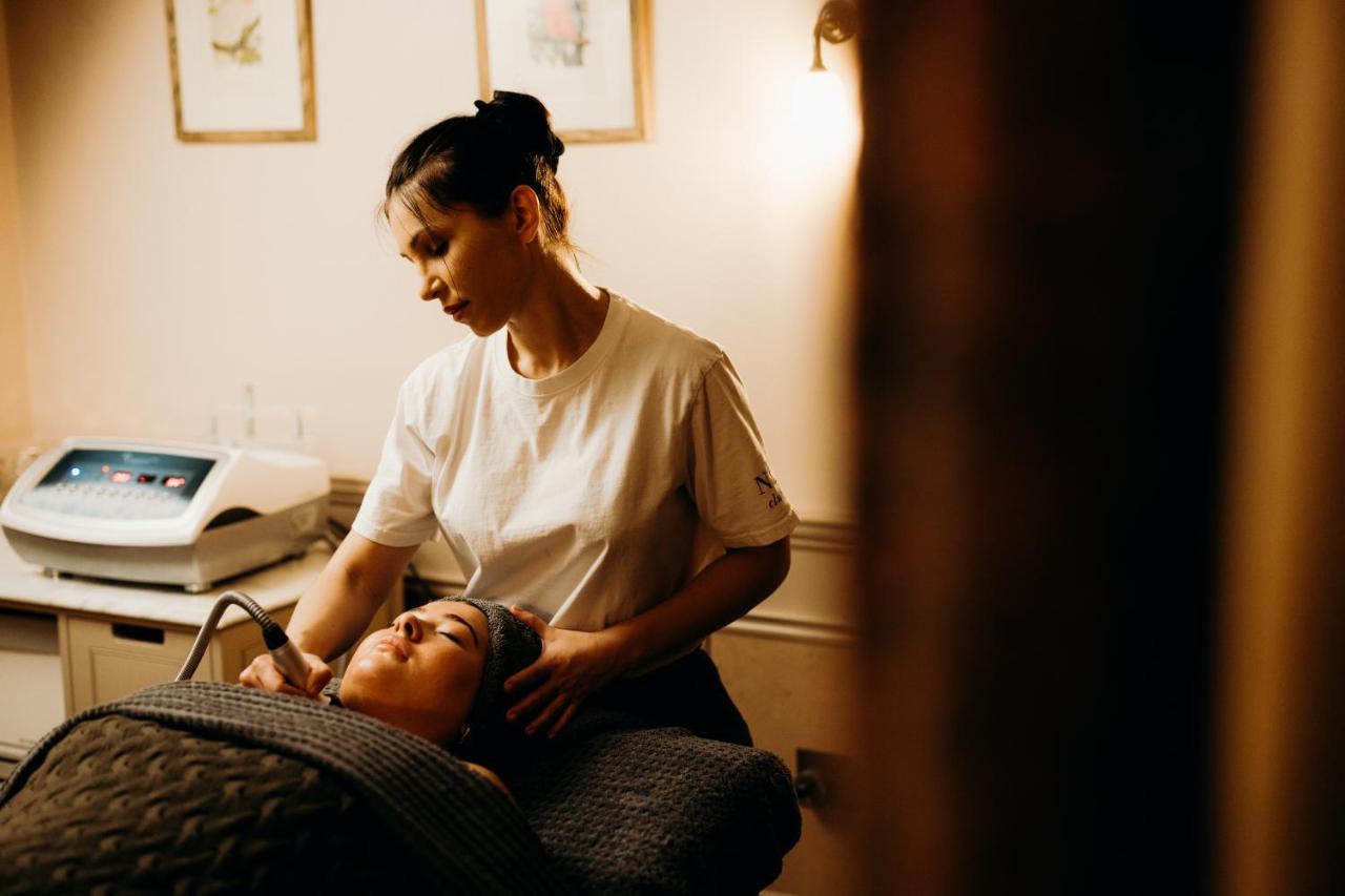 The Ned Hotel London Exterior photo A woman receiving a facial treatment