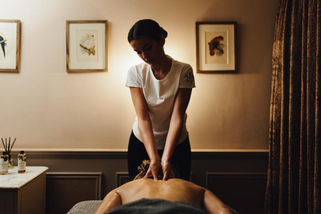 The Ned Hotel London Exterior photo A massage therapist treating a patient