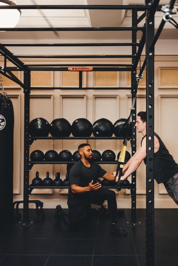The Ned Hotel London Exterior photo A personal trainer working with a client