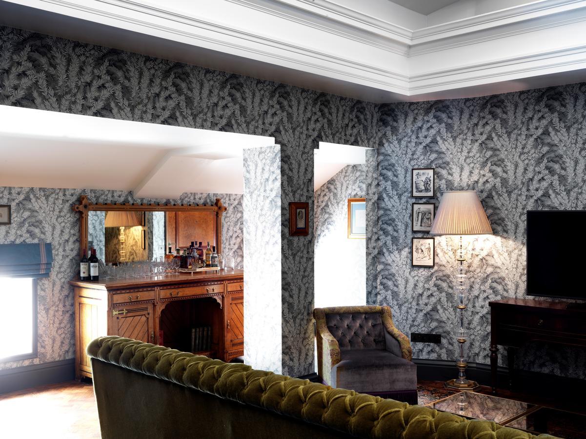 The Ned Hotel London Exterior photo A room with wallpaper